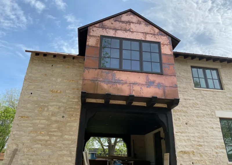 Copper metal panel facade on a stone building for Skylight Installation in East Fishkill